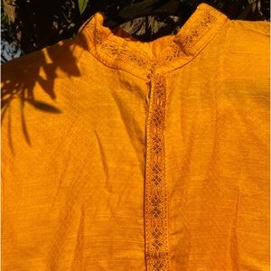 Bright golden yellow Sherwanis.